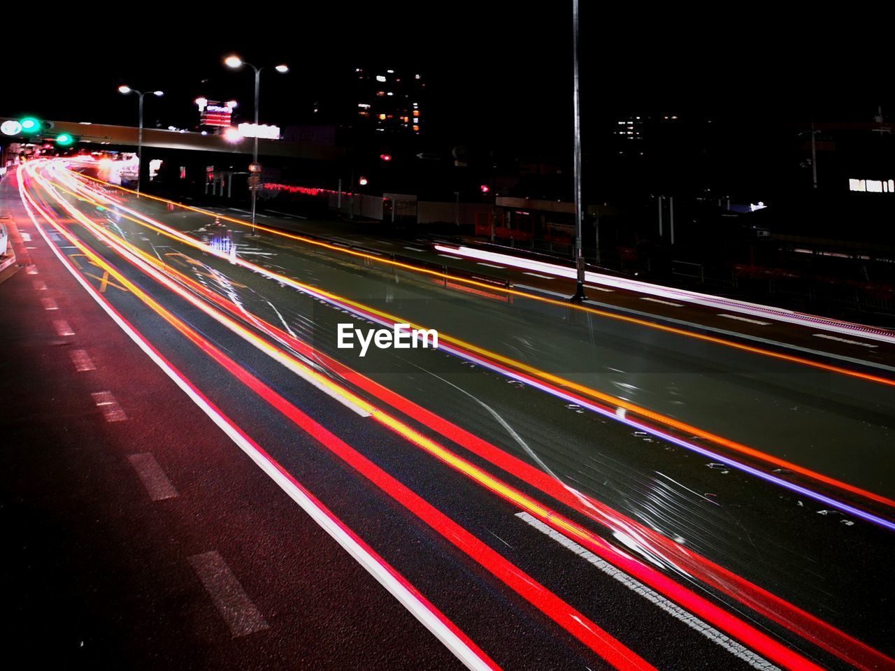 BLURRED MOTION OF LIGHT TRAILS ON ROAD