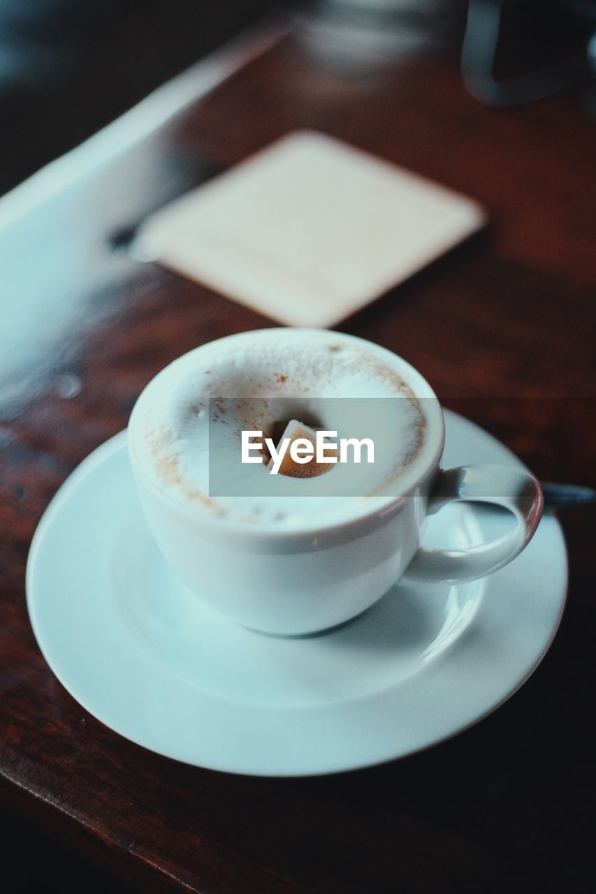 CLOSE-UP OF COFFEE SERVED ON TABLE