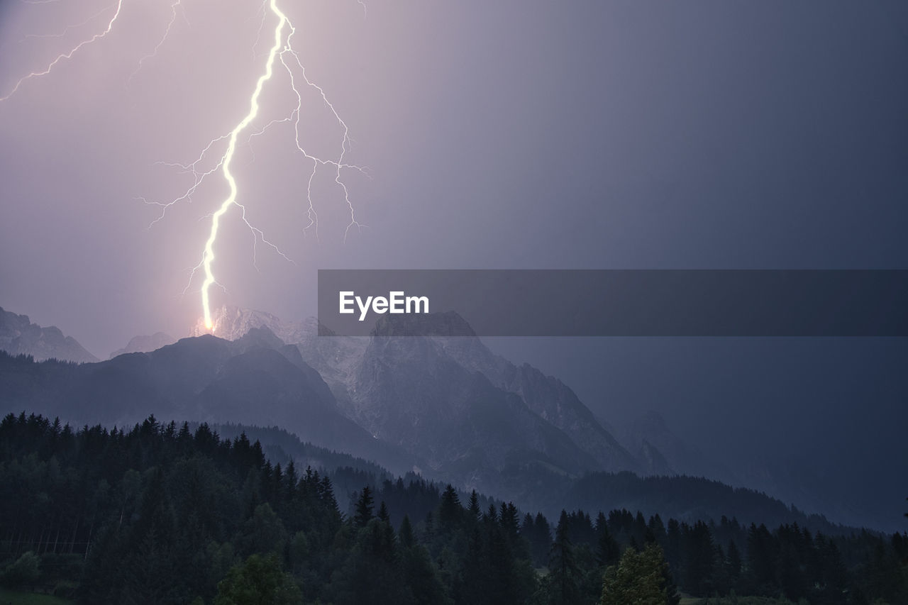 Dramatic lightning strike during a thunderstorm in the steinberg in leogang, salzburg, austria