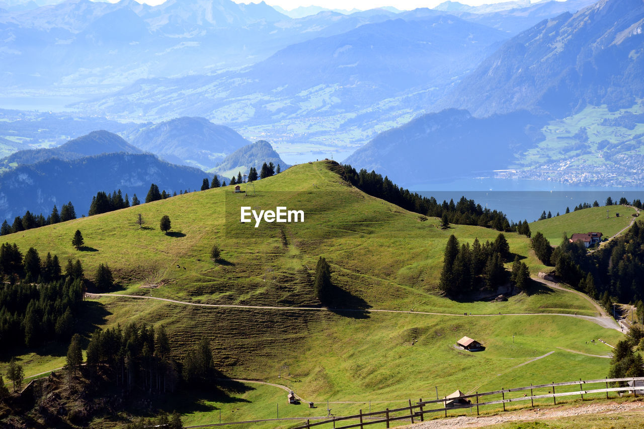 Scenic view of landscape and mountains against sky