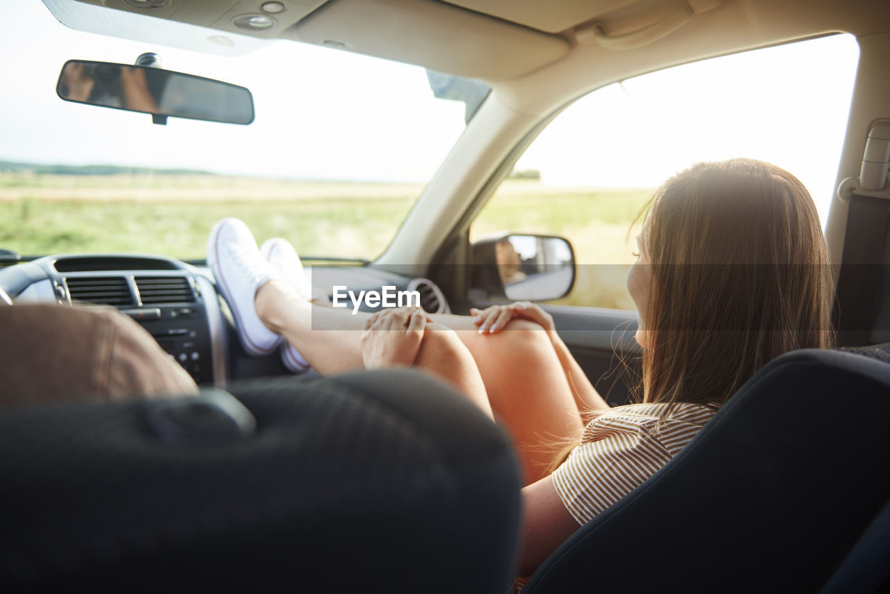 Woman relaxing in car