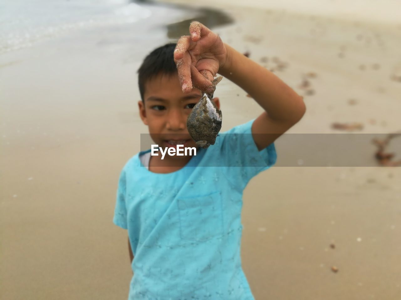 Portrait of cute boy at beach