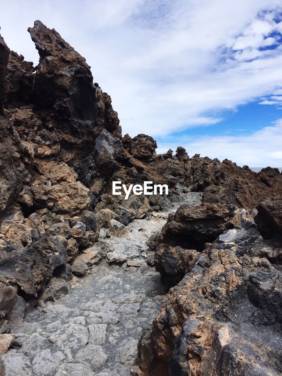 Low angle view of rock formation against sky