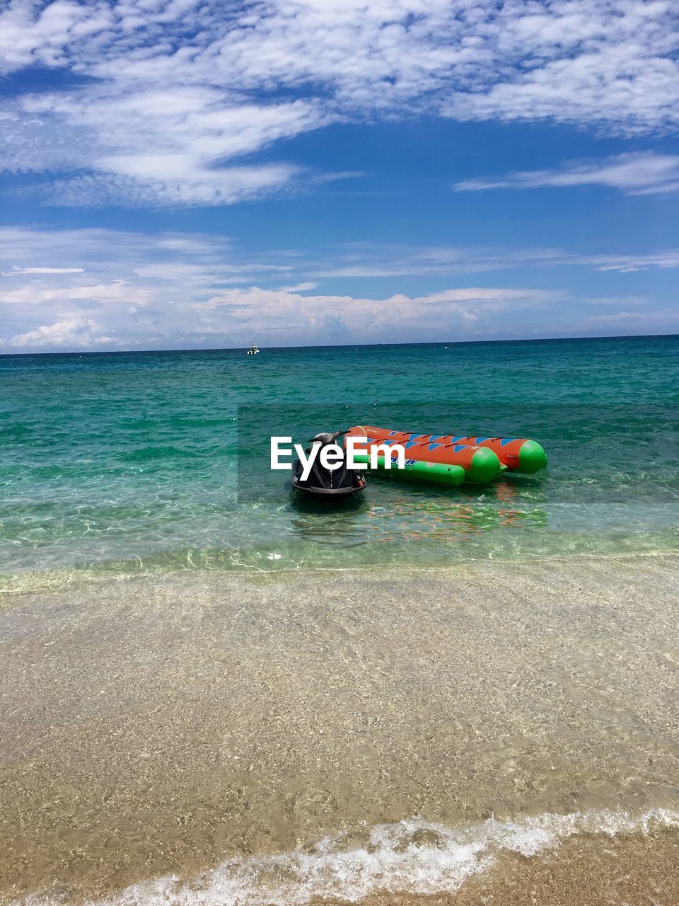 Water sport equipment in sea against sky