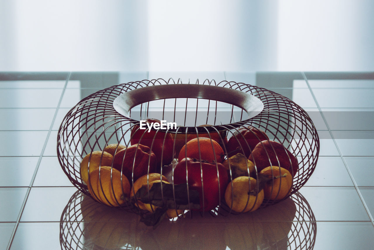 CLOSE-UP OF APPLES IN BASKET