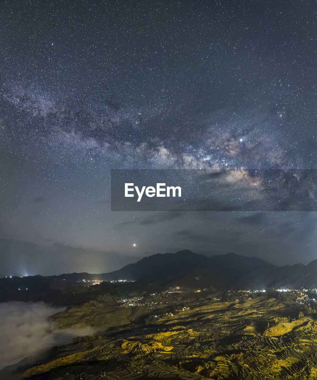 SCENIC VIEW OF LANDSCAPE AGAINST STAR FIELD