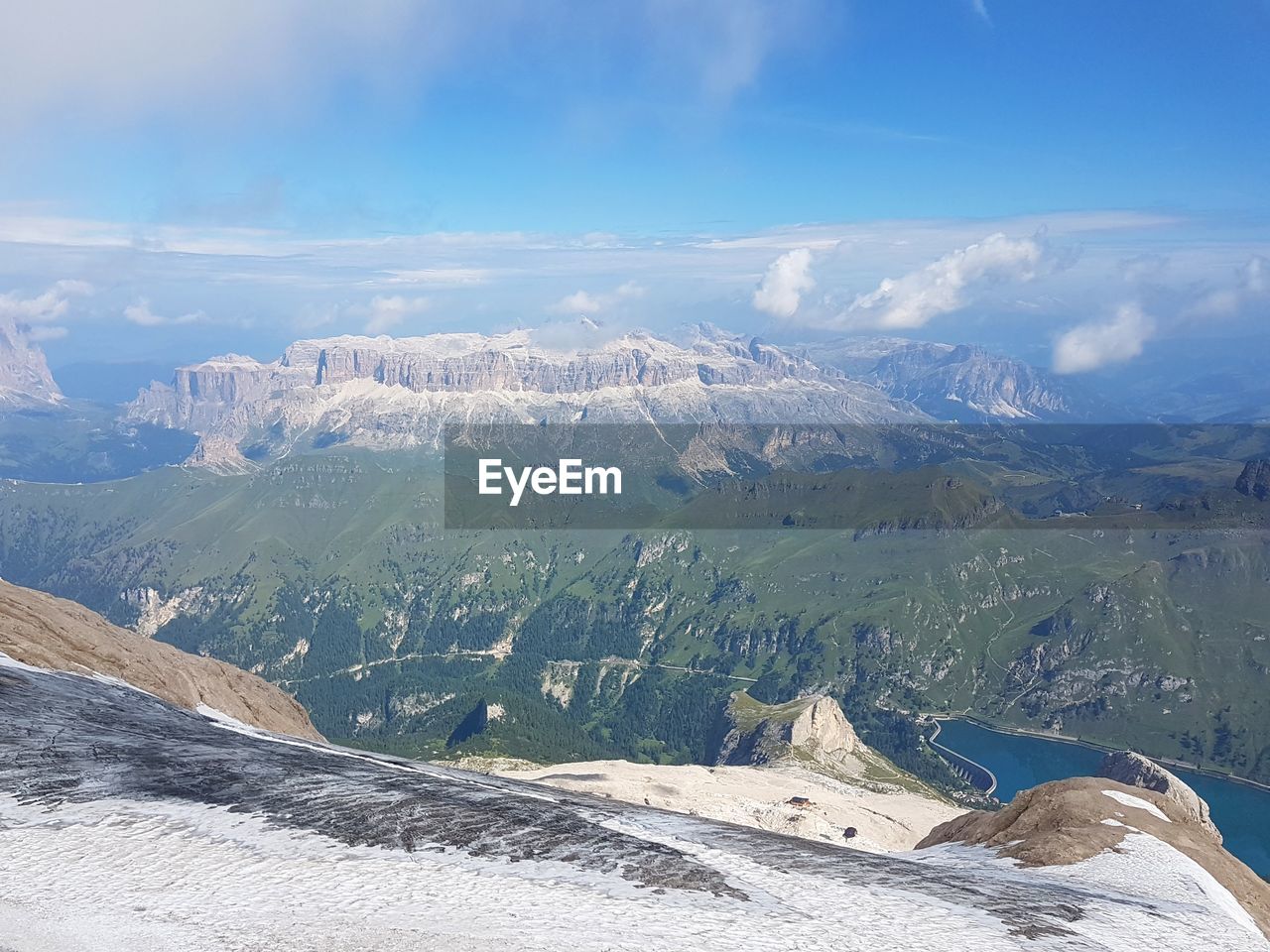 Aerial view of snowcapped mountains against sky