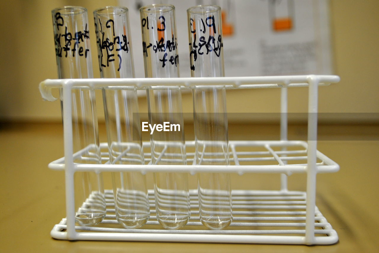 Close-up of test tubes on rack at table