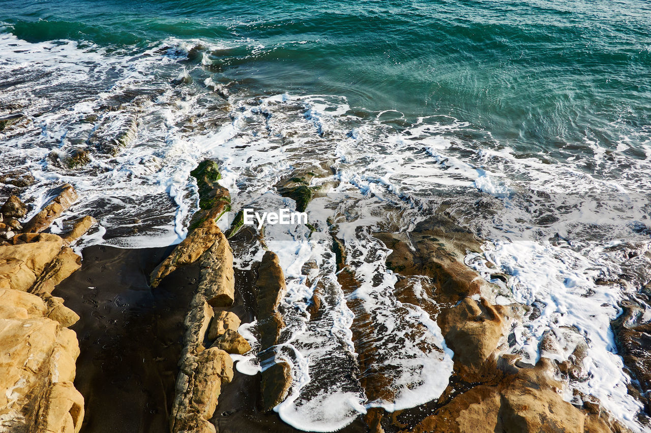 High angle view of rocks on beach