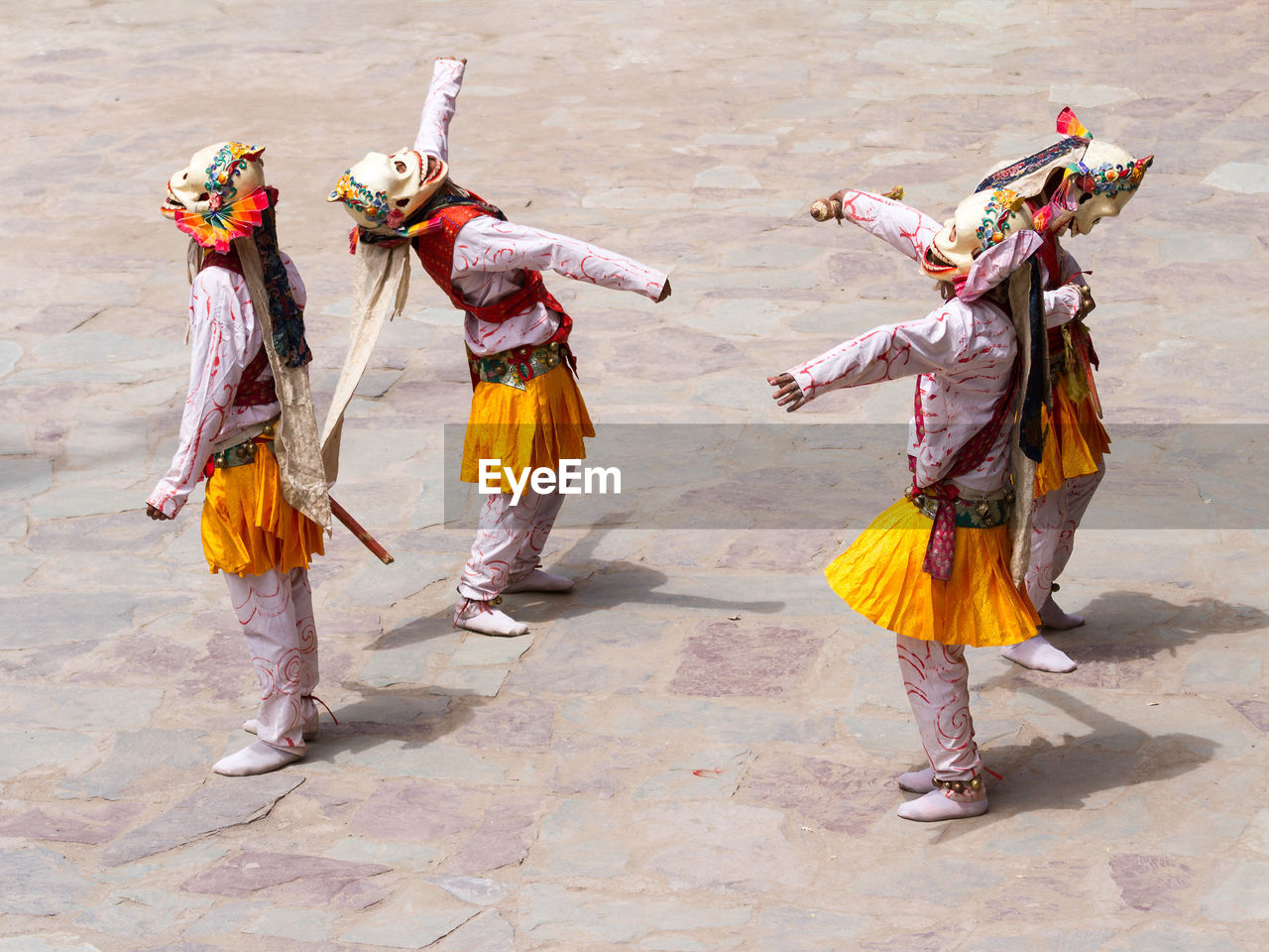 GROUP OF PEOPLE DANCING IN MID-AIR