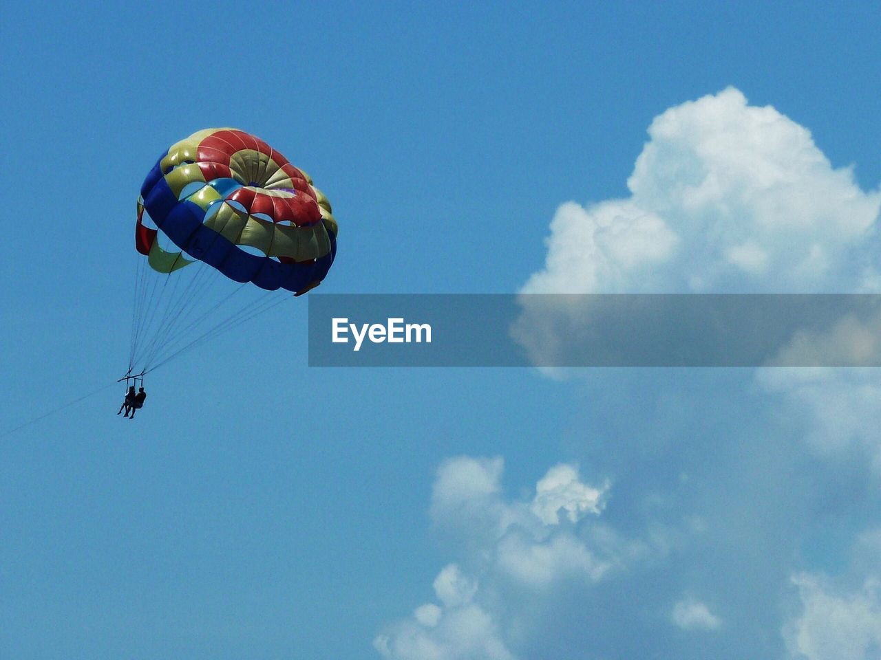 People paragliding in sky