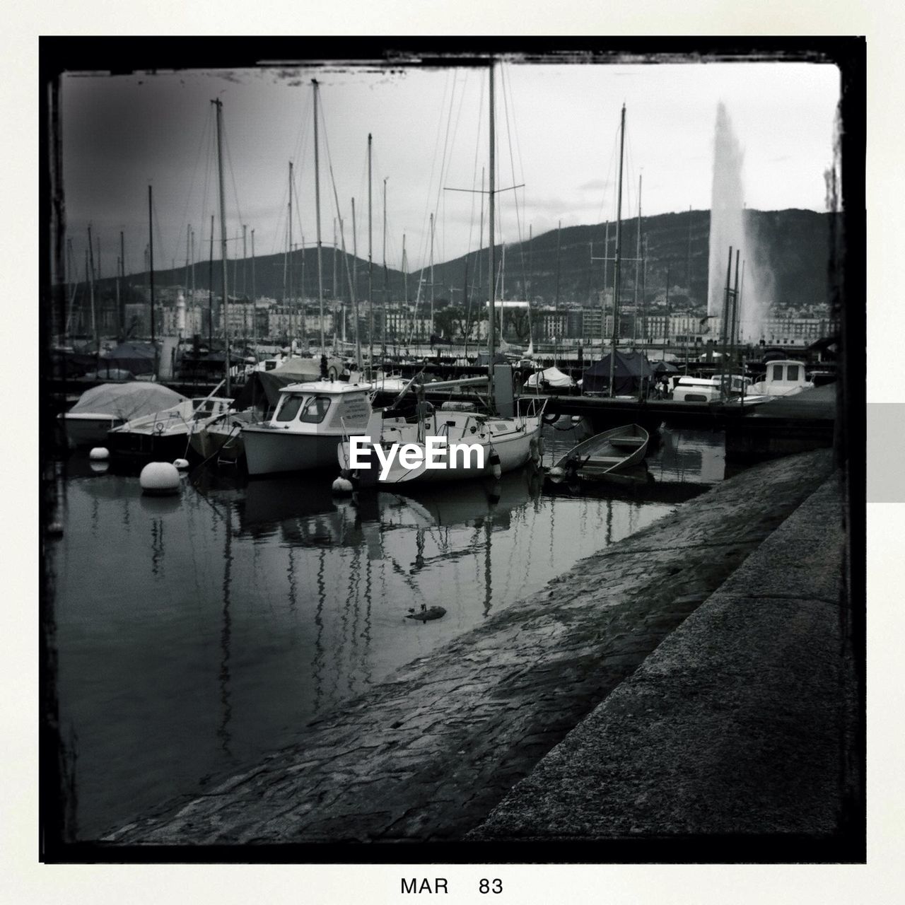 BOATS MOORED IN SEA