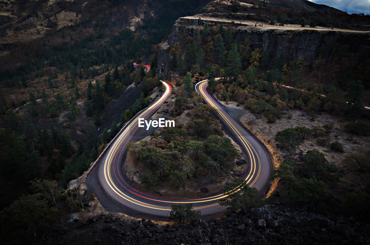 High angle view of light trails on road at night