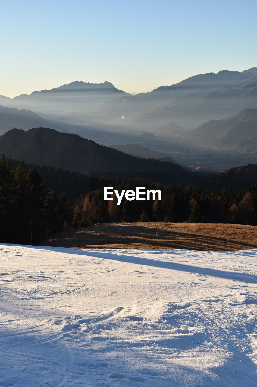 Idyllic view of snowcapped landscape