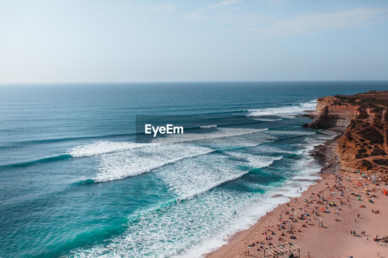 Scenic view of sea and beach against clear sky surf spot