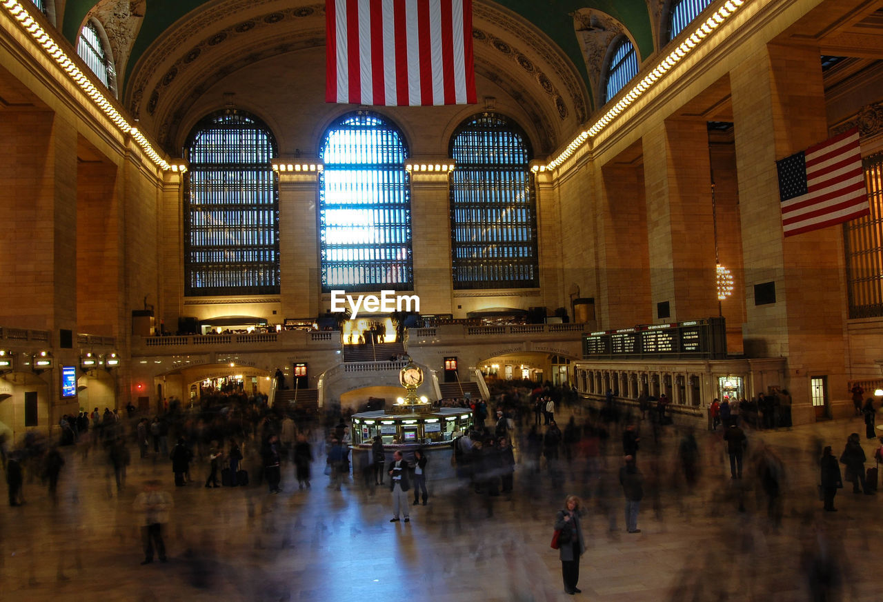 People at illuminated grand central station