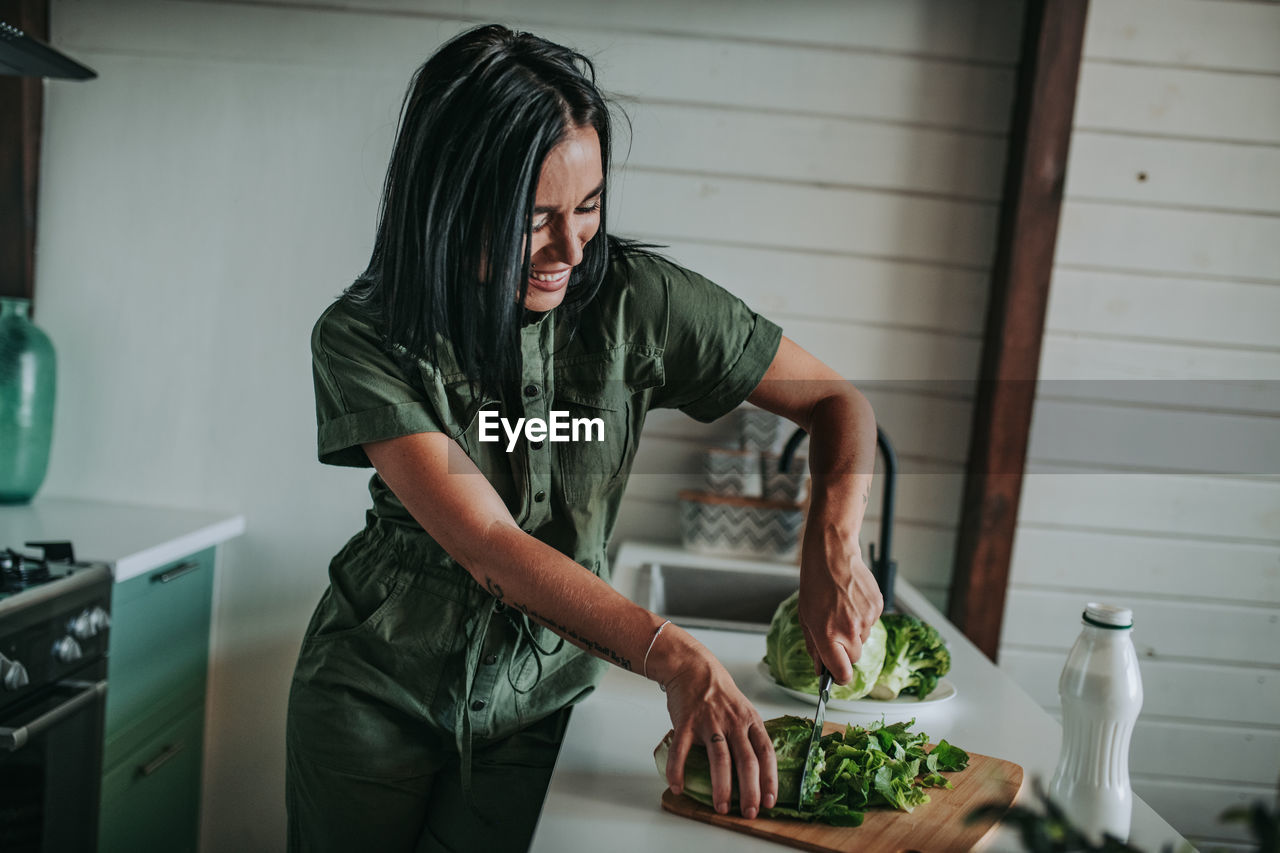 Midsection of man preparing food at home