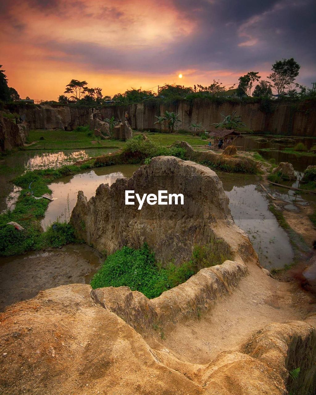 Scenic view of river against cloudy sky