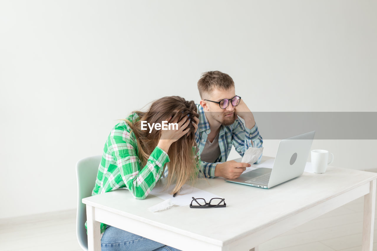 Young man using laptop on table