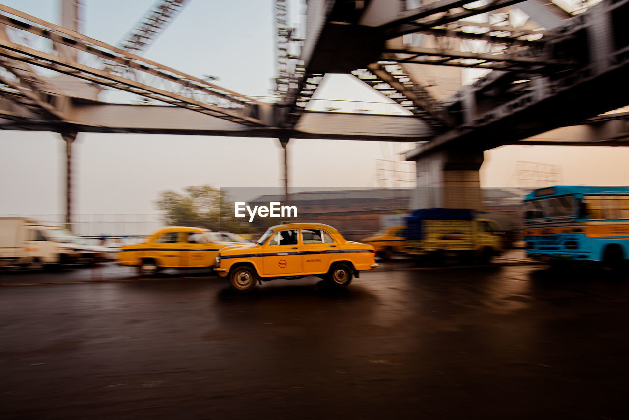 View of yellow car on road
