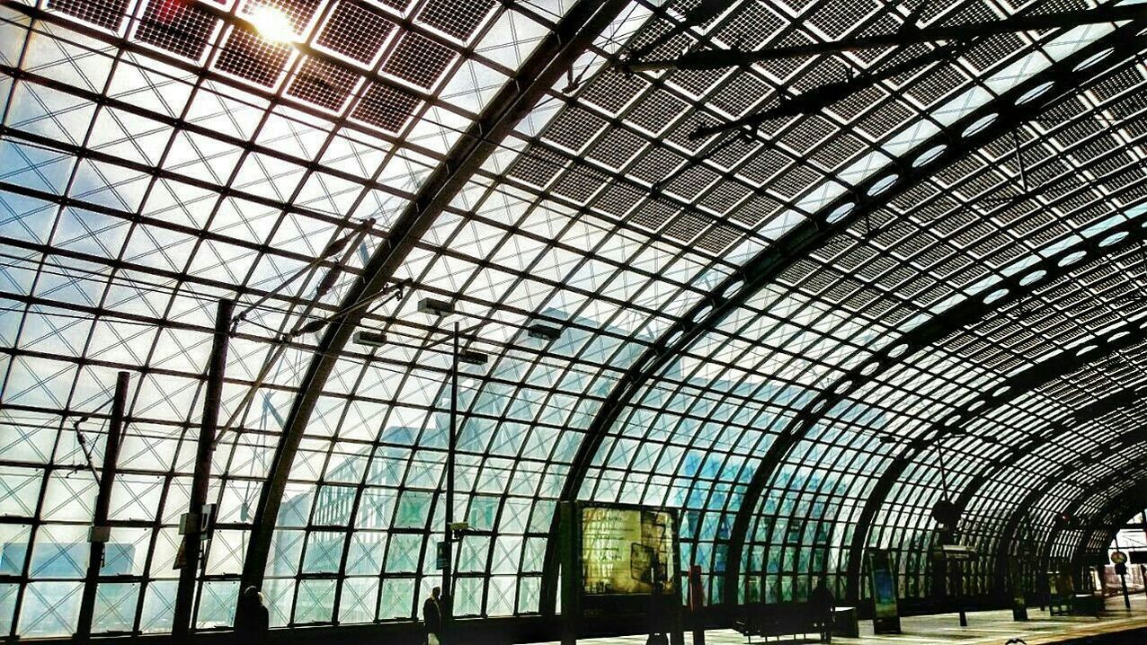 Low angle view of glass ceiling at railroad station