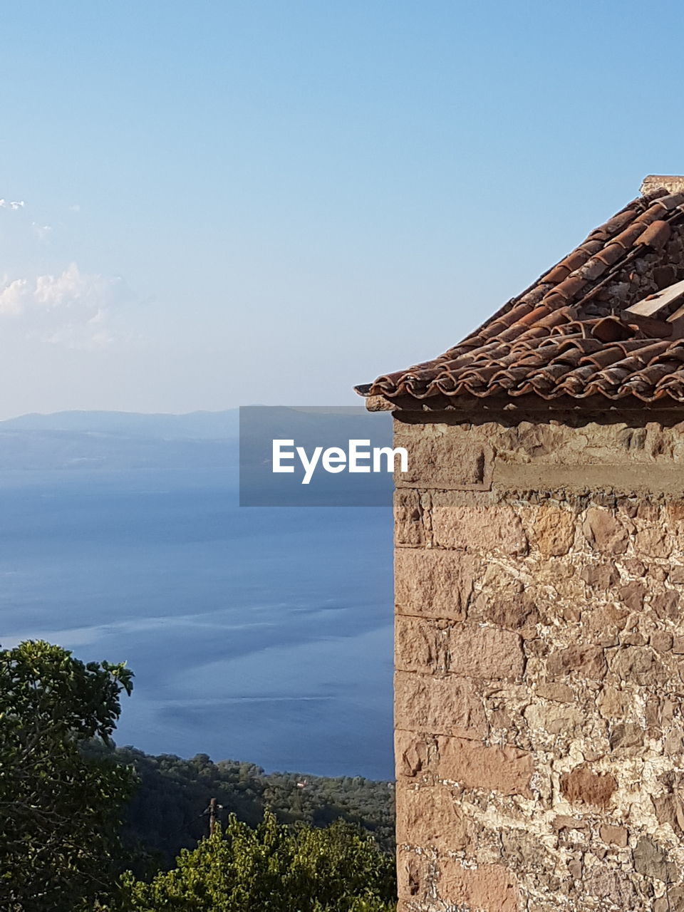 Scenic view of mountains against clear blue sky