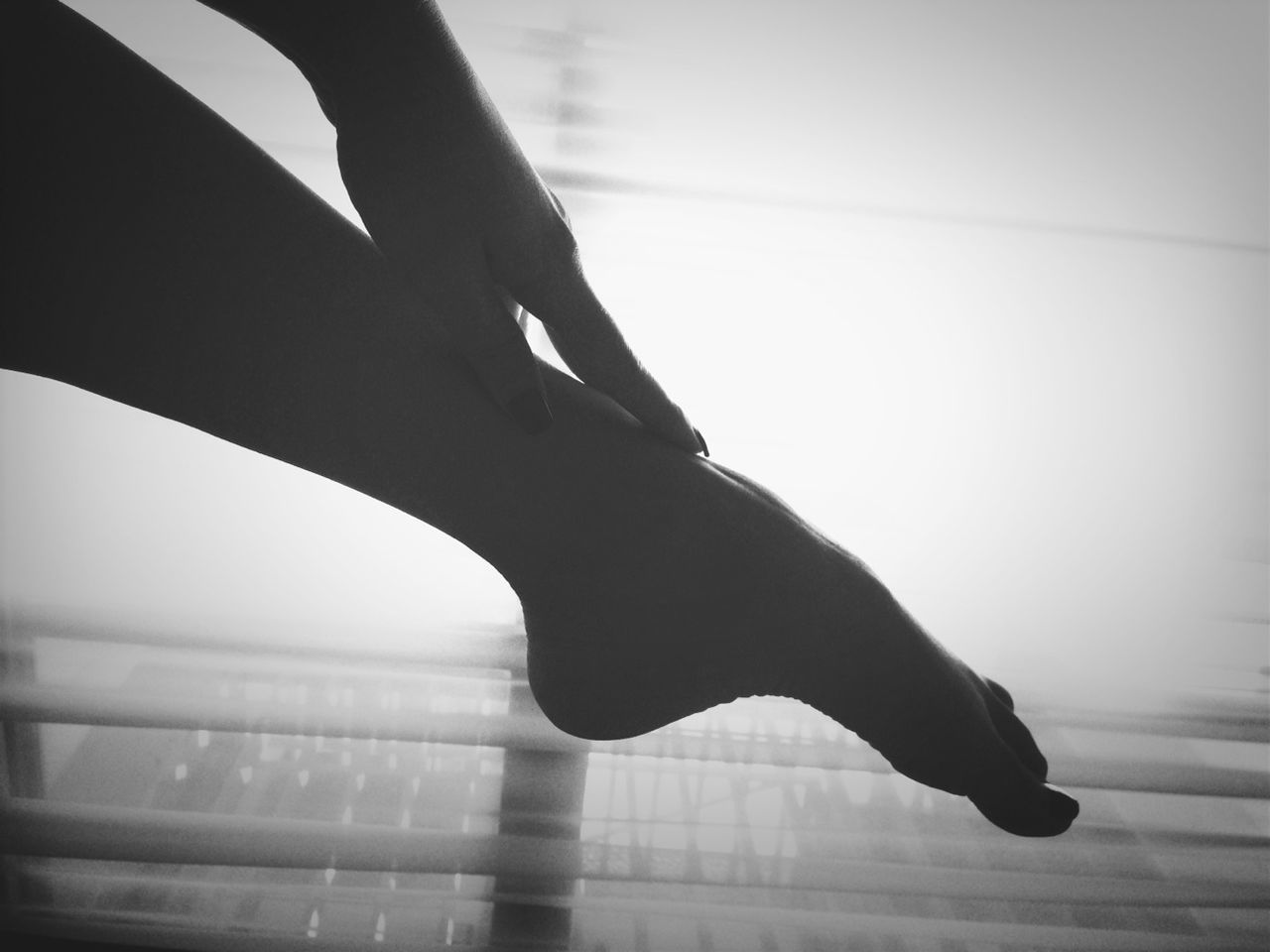 Low section of silhouette womans leg