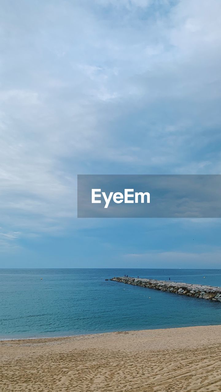 SCENIC VIEW OF BEACH AND SEA AGAINST SKY