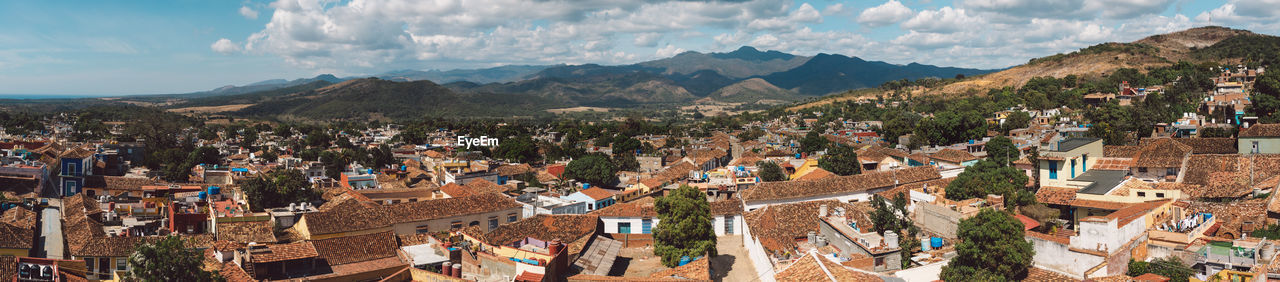 Panoramic view of town against sky