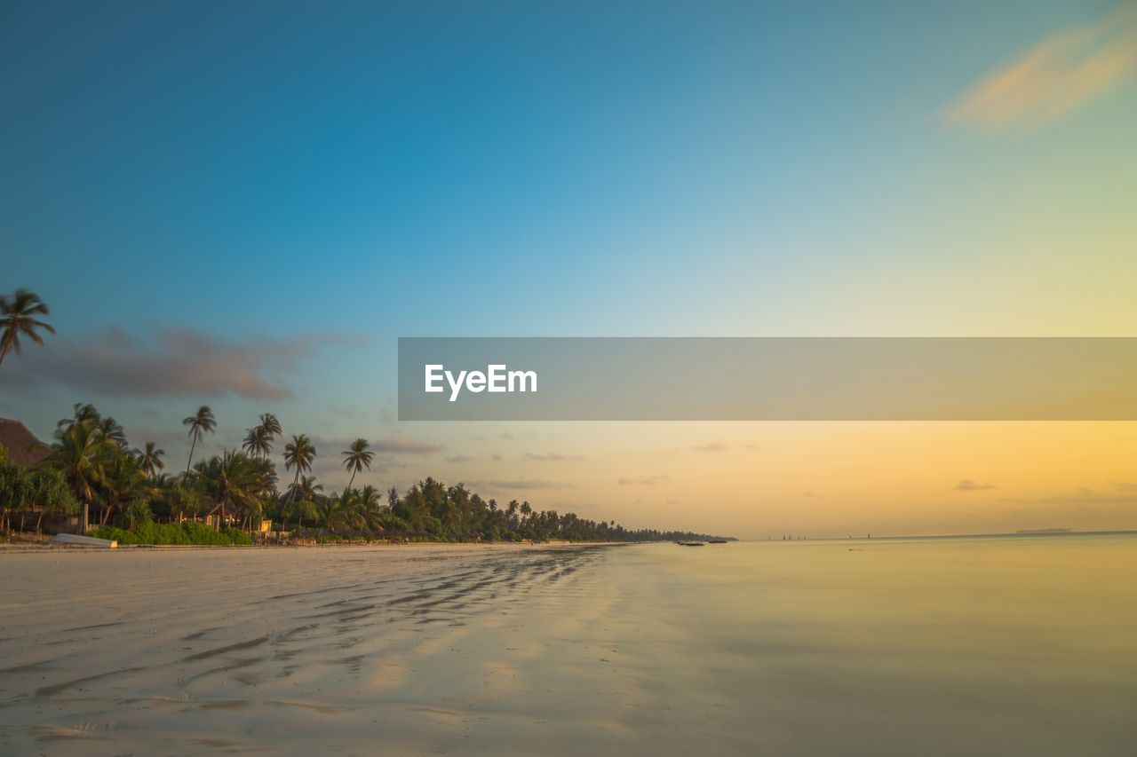 Scenic view of sea against sky at sunset