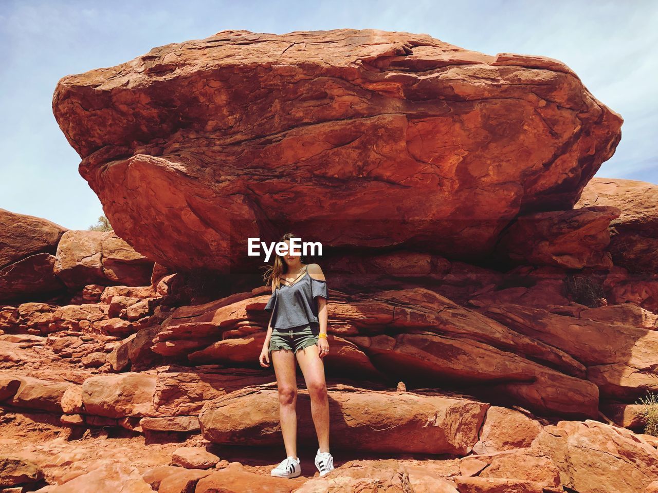 Full length of woman standing on rock formations