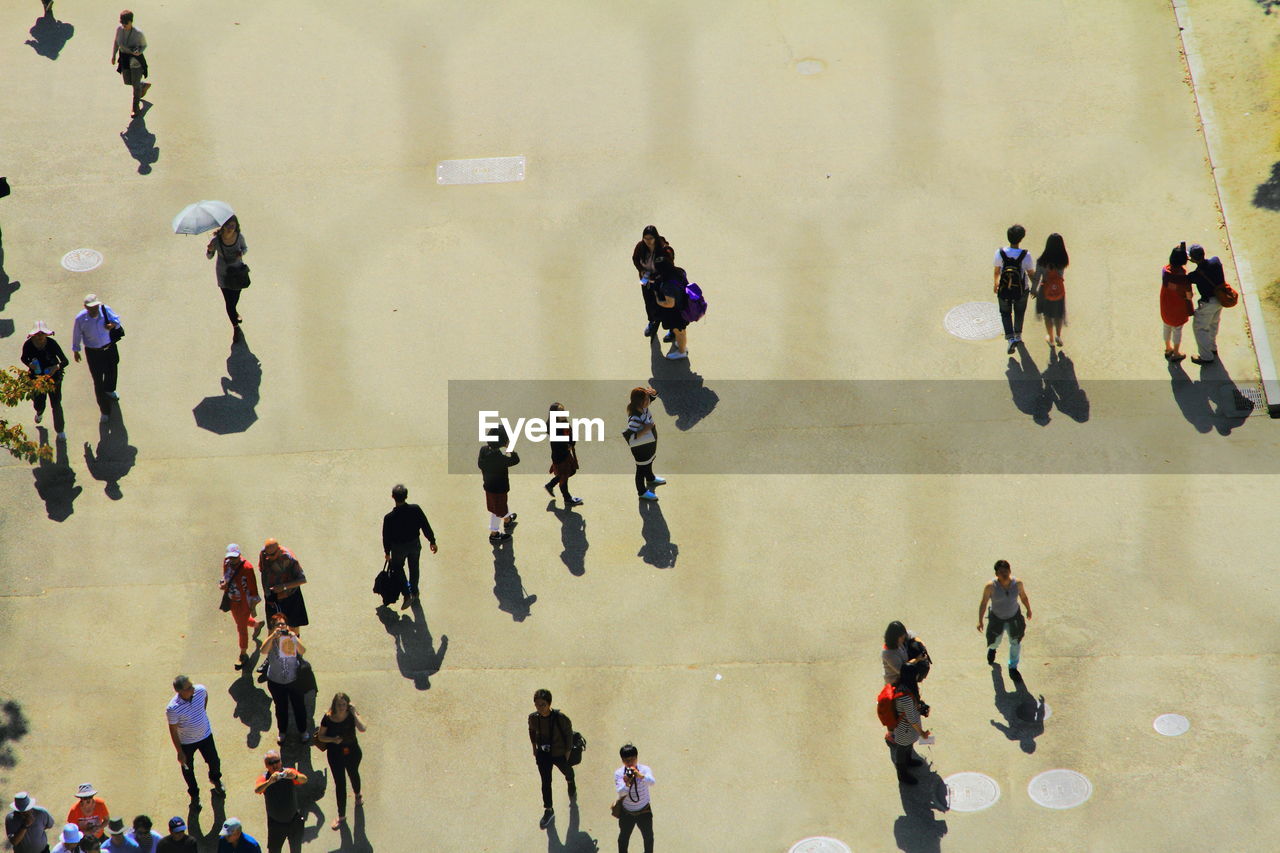 High angle view of people standing on floor