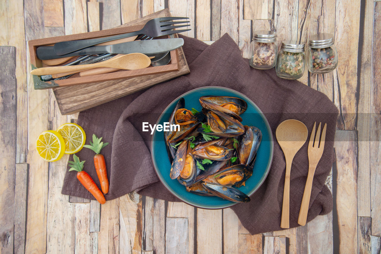 High angle view of mussels in plate on table