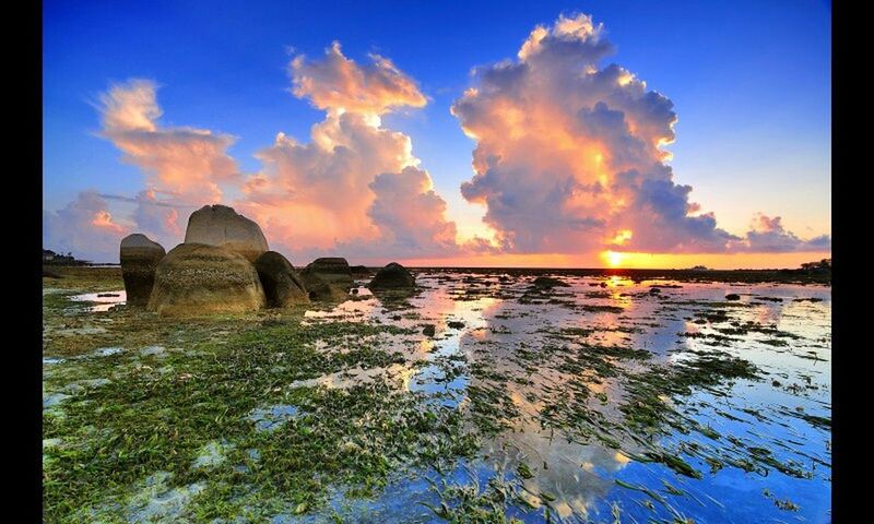 SCENIC VIEW OF SUNSET OVER SEA