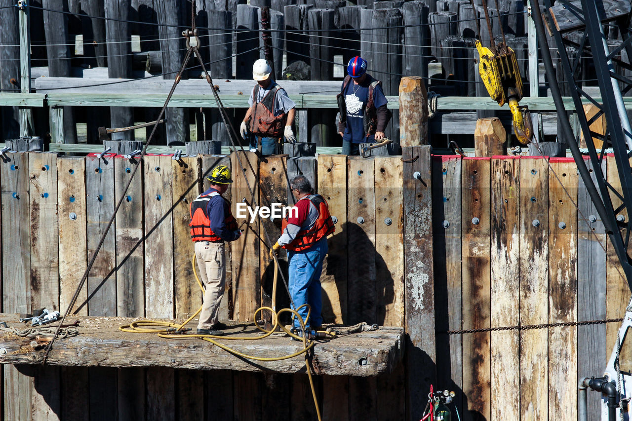 MEN WORKING ON CONSTRUCTION SITE