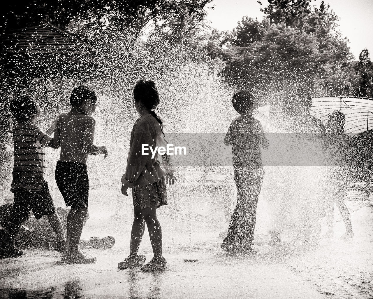 Children playing in splashing water