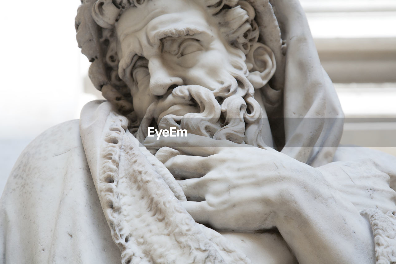 Statue, human representation, symbol of winter or cold climate, old bearded man representation
