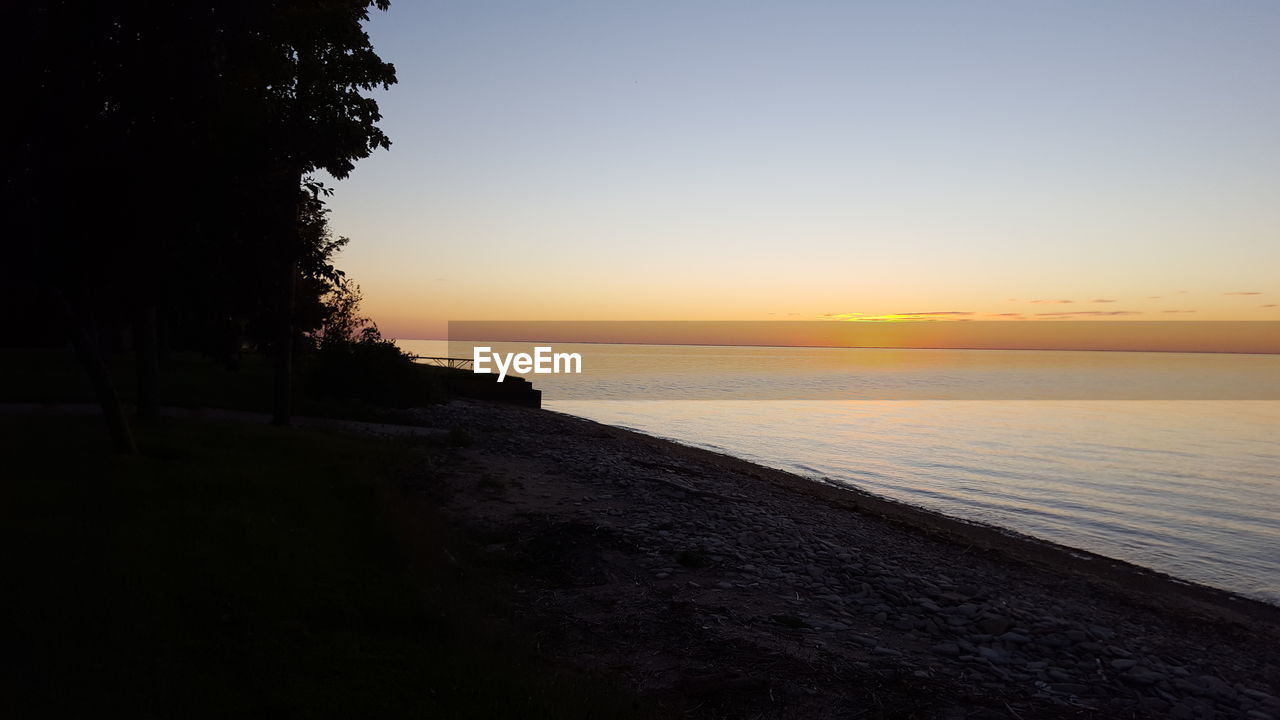 SCENIC VIEW OF SEA DURING SUNSET