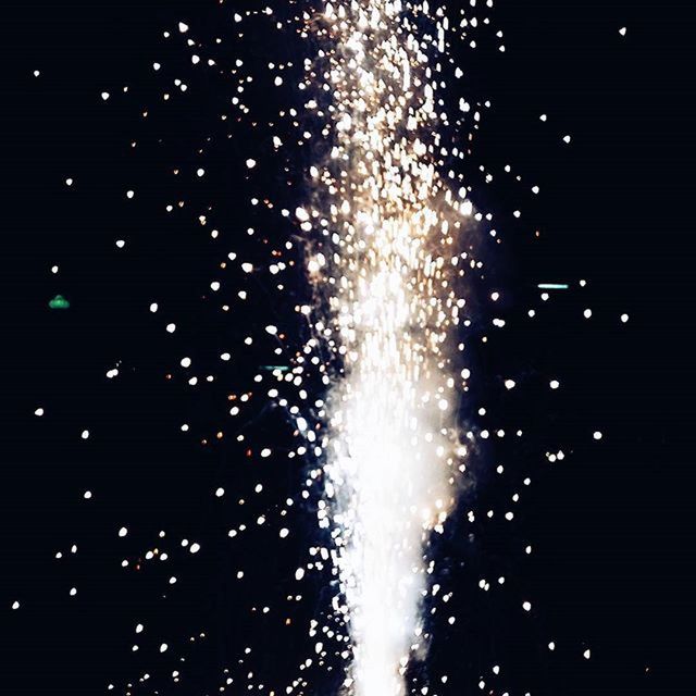 LOW ANGLE VIEW OF FIREWORKS DISPLAY