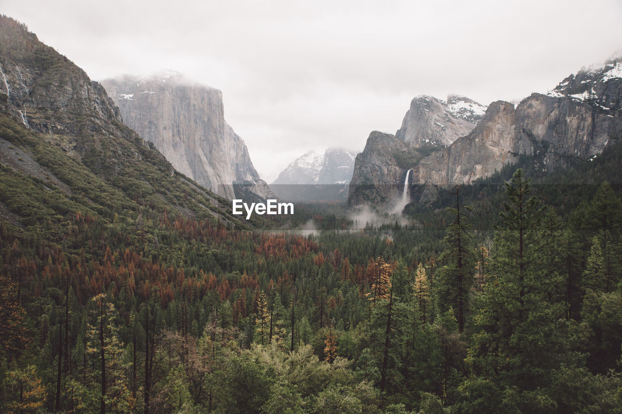 Scenic view of mountains against cloudy sky