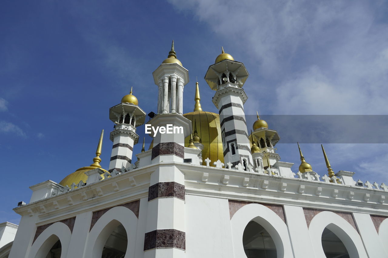 View of mosque against blue sky