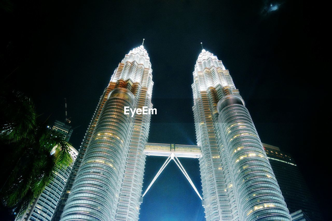 LOW ANGLE VIEW OF ILLUMINATED SKYSCRAPER