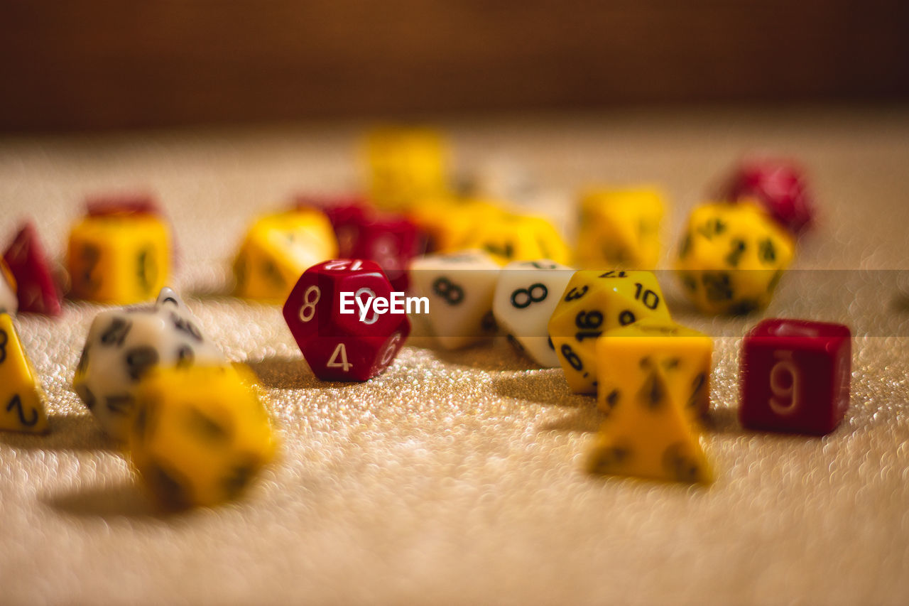 Close-up of dice on textile