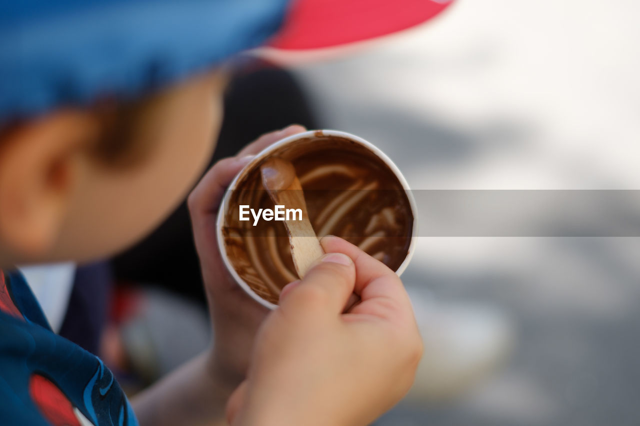 Close-up of hand holding ice cream