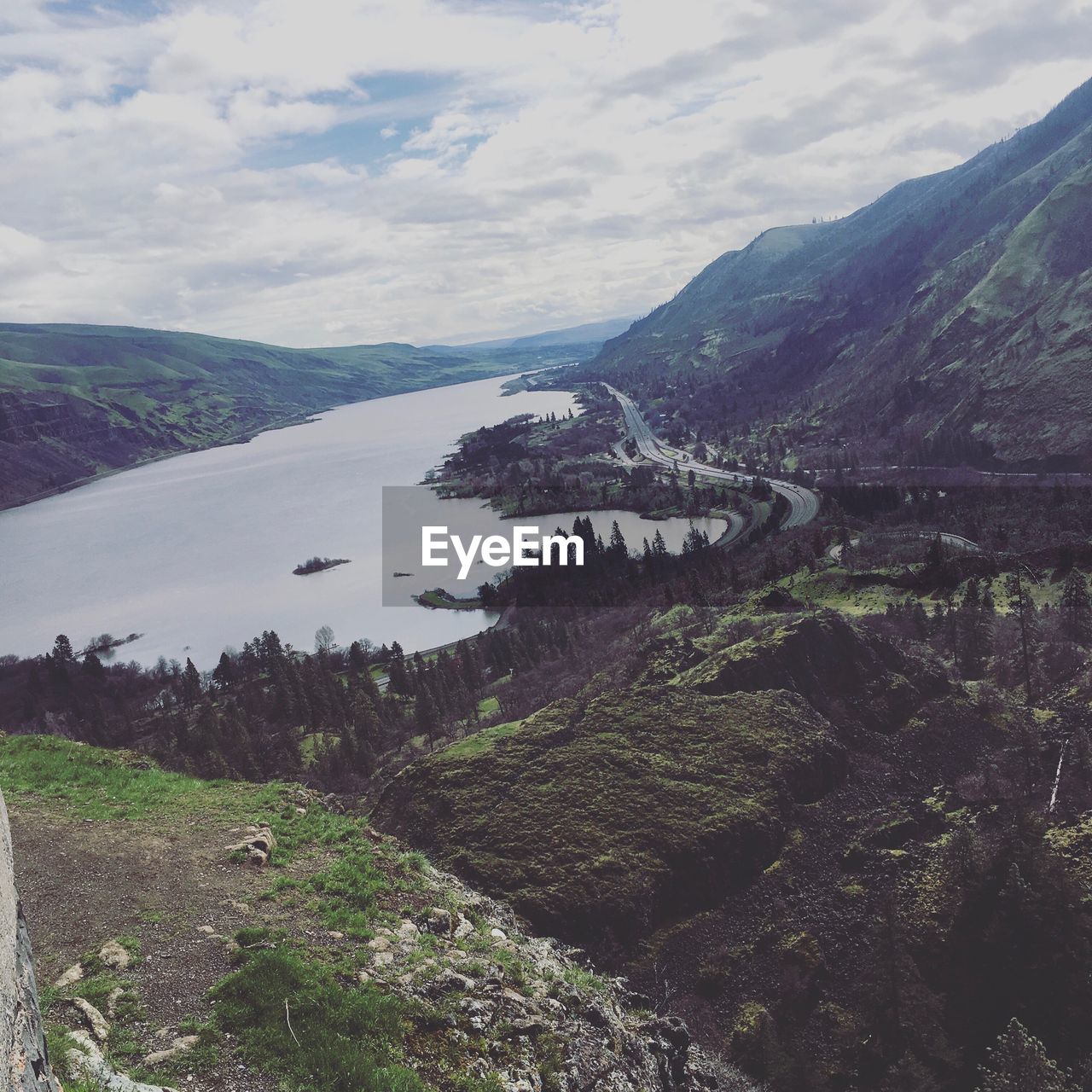 Scenic view of mountains against cloudy sky