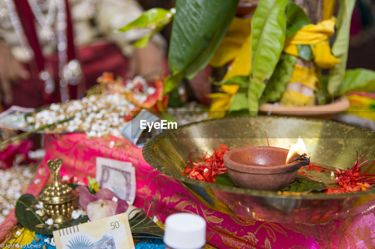 Oil lamp in plate during wedding ceremony
