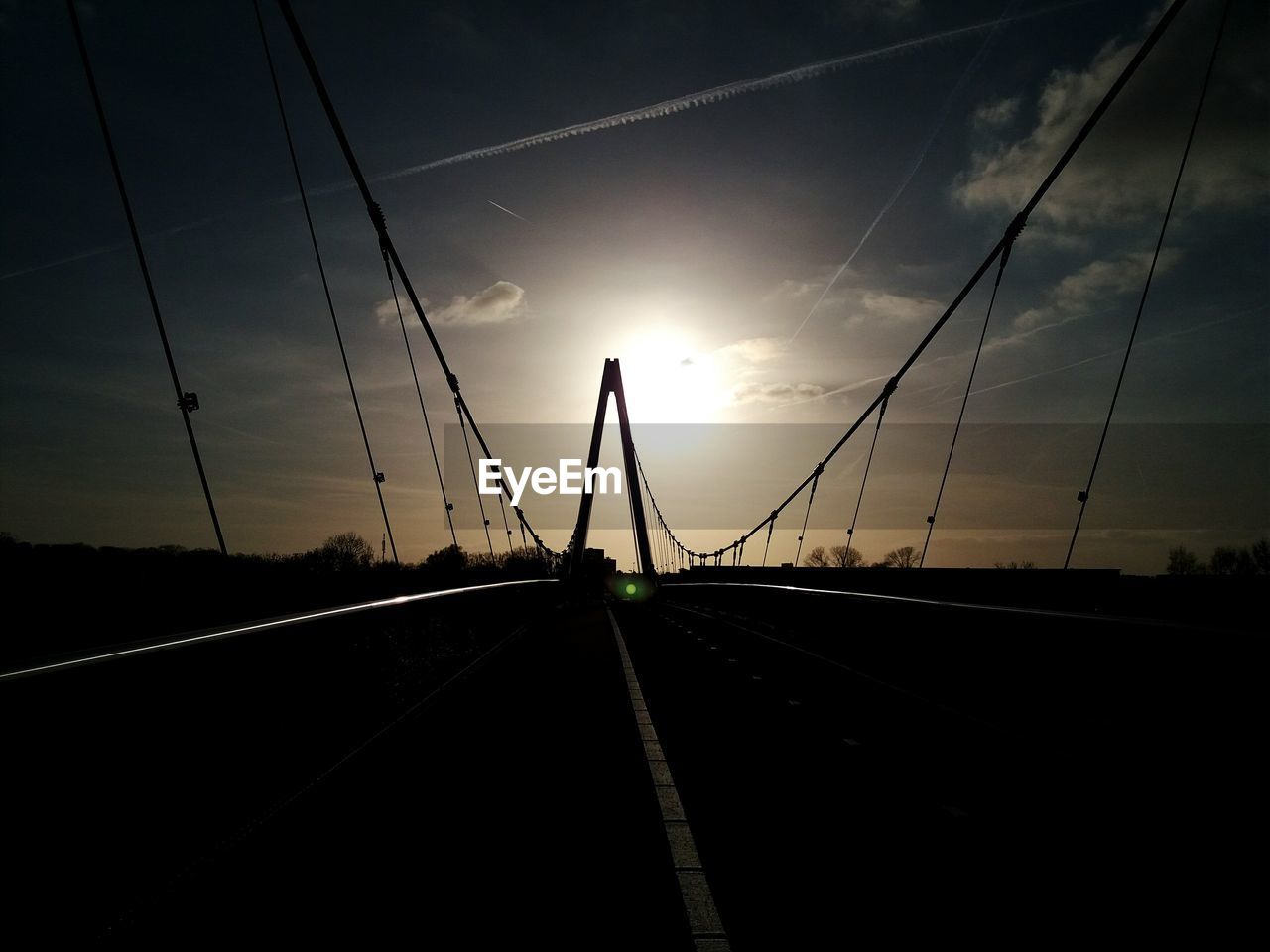 ROAD AGAINST SKY DURING SUNSET