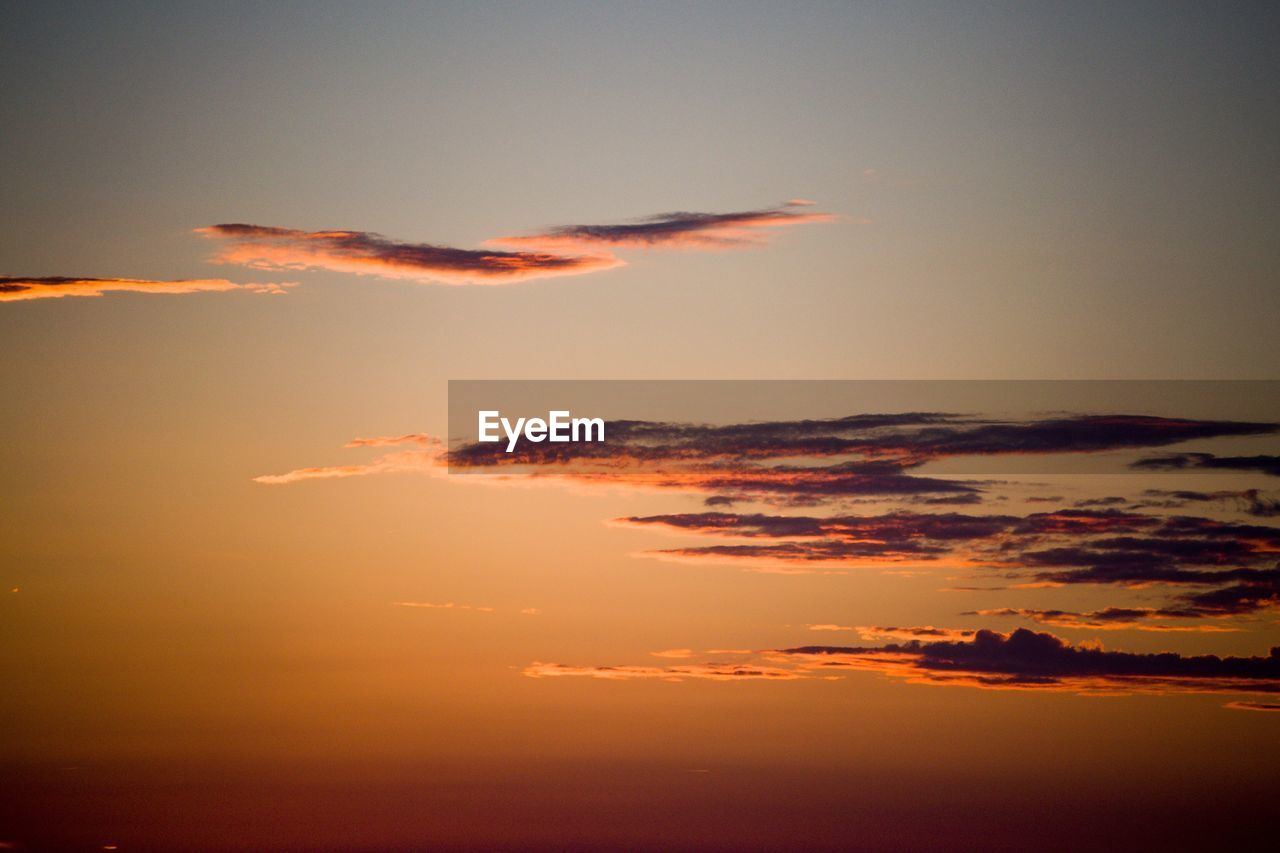 Scenic view of dramatic sky during sunset