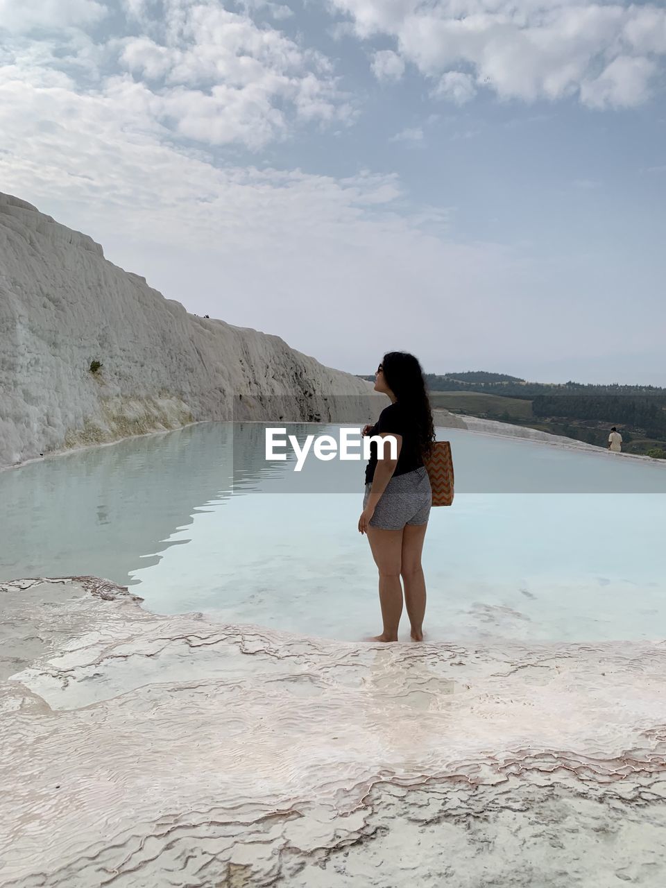 sea, one person, water, vacation, adult, shore, coast, women, full length, land, nature, sky, beach, young adult, trip, holiday, leisure activity, clothing, sand, ocean, beauty in nature, cloud, body of water, lifestyles, standing, day, tranquility, scenics - nature, travel, environment, long hair, fashion, person, rear view, hairstyle, landscape, relaxation, outdoors, solitude, wave, casual clothing, female, mountain, travel destinations, summer, human leg, walking, rock, tranquil scene, dress, swimwear, reflection, bikini, looking, idyllic, tourism, remote, non-urban scene