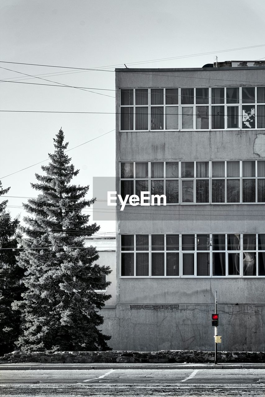 VIEW OF BUILDING THROUGH WINDOW